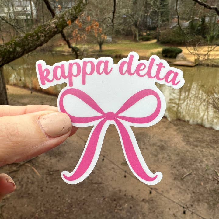 Sticker | KD_O | Kappa Delta Pink Bow | Waterproof Vinyl Sticker | White | Clear | Permanent | Removable | Window Cling | Glitter | Holographic for wholesale by My Vinyl Cut