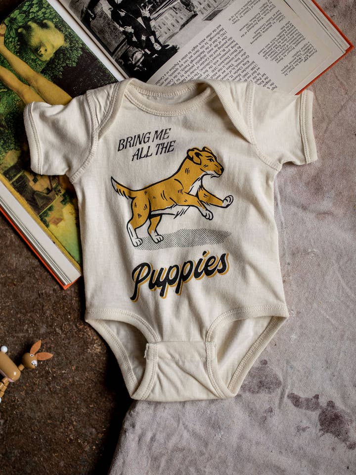 Natural Bring Me All The Puppies Infant Onesie for wholesale on Faire