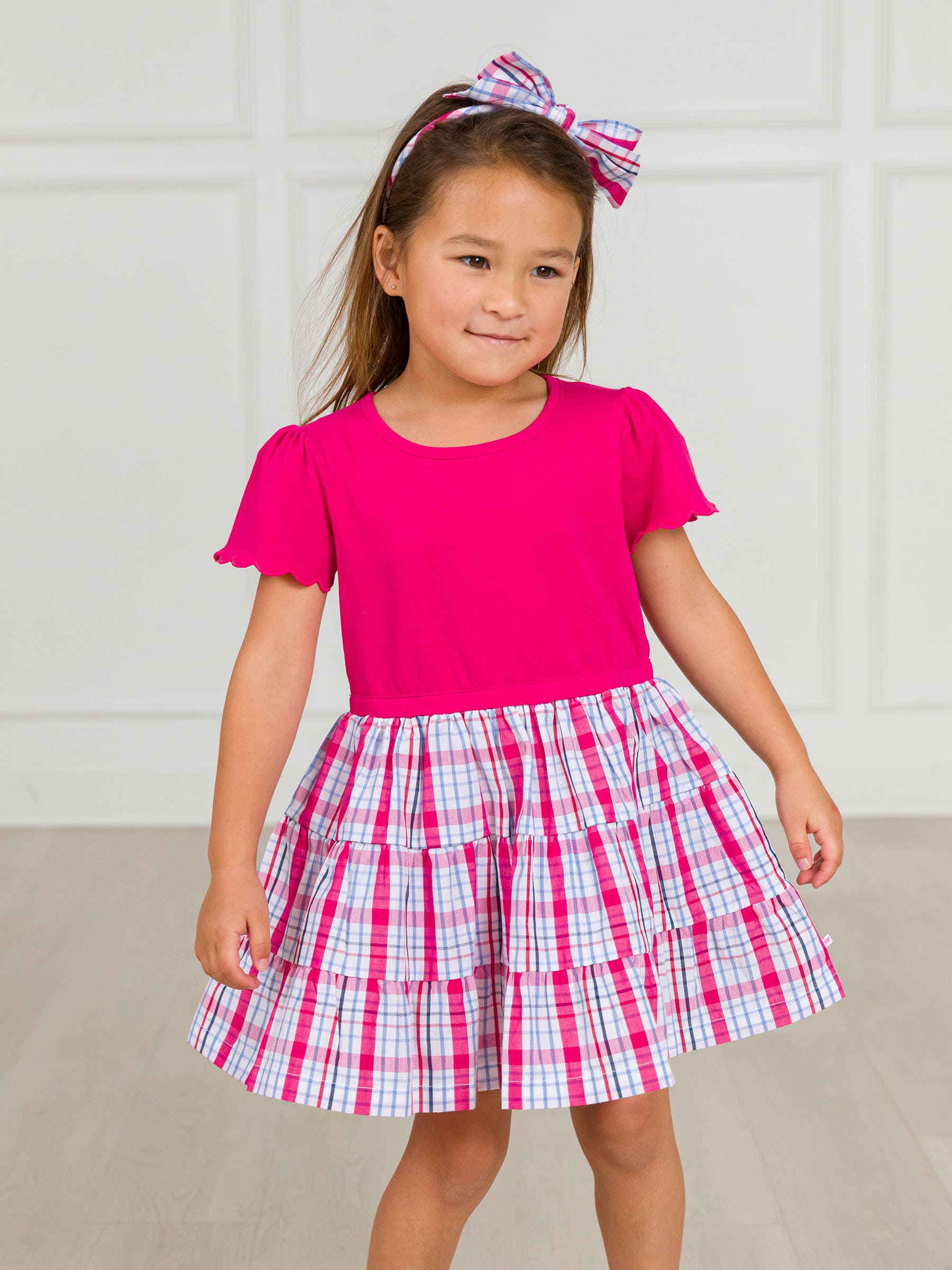 Pink Girls Adley Plaid Short Sleeve Tiered Dress for wholesale on Faire1