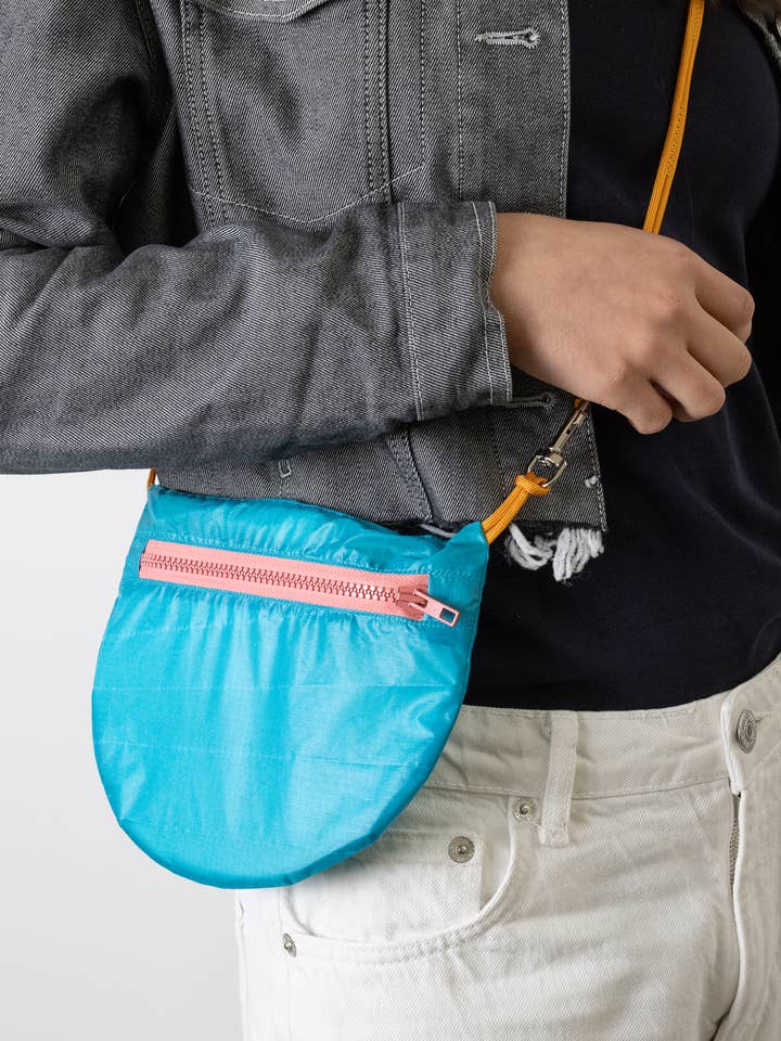 Women's sling bag made from vintage paragliders for wholesale by TheVIVgoods