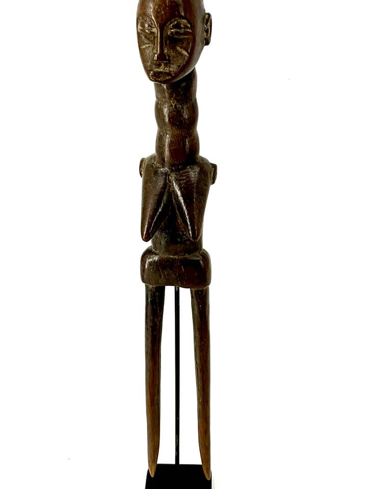 Baule Hair Pick - Ivory Coast on stand for wholesale by Jofa African Imports