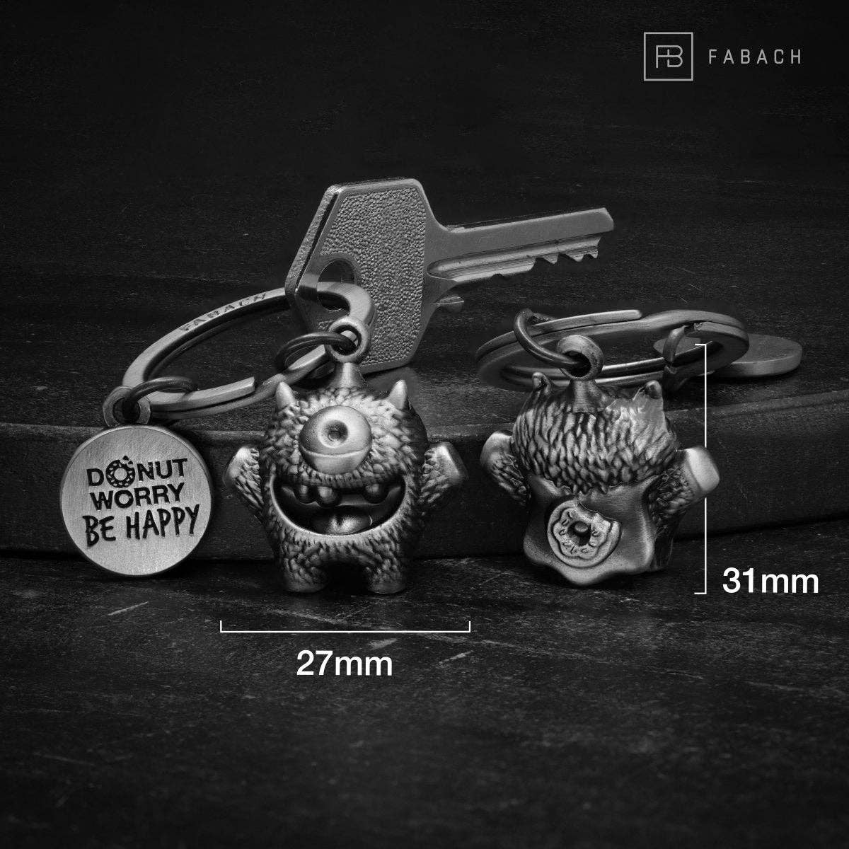 FABACH – Die Schlüsselanhänger-Schmiede – Porta-chaves - Unissexo por atacado – Chaveiro 'Cyklops' de incentivo – monstrinho sorteado com gravação 'Donut worry, be happy!' – amuleto da sorte Kummermampfer7