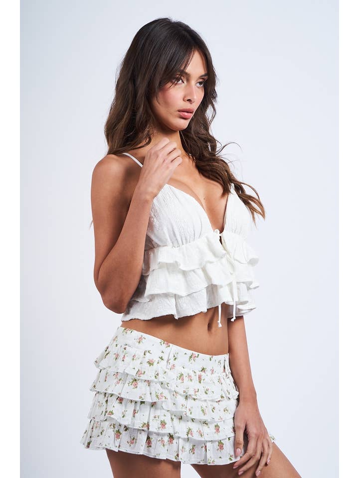 OEILLET BLANC CROP TOP À VOLANTS SANS MANCHES BLANC À OEILLETS EN FORME DE CŒUR en vente sur Faire4