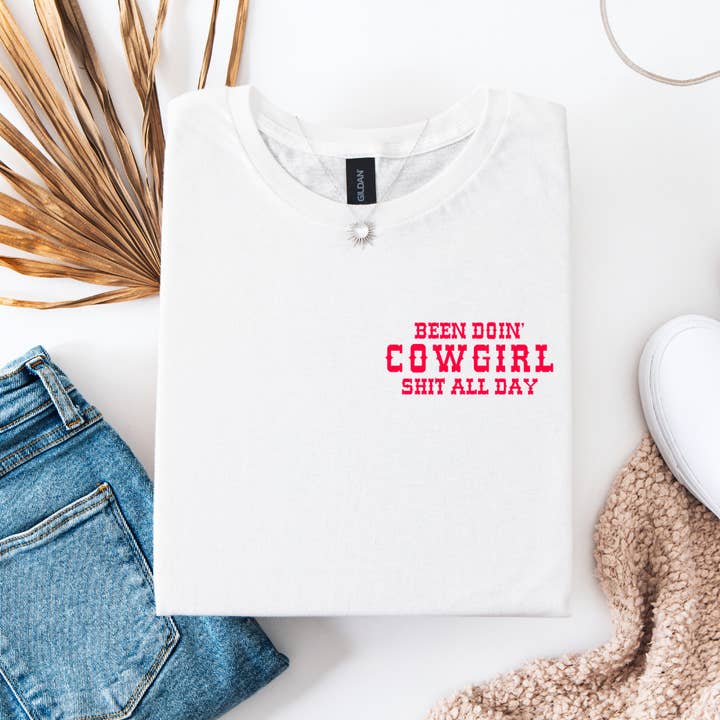 BEEN DOIN' COWGIRL SHIT TSHIRT for wholesale by Wild & Wanted