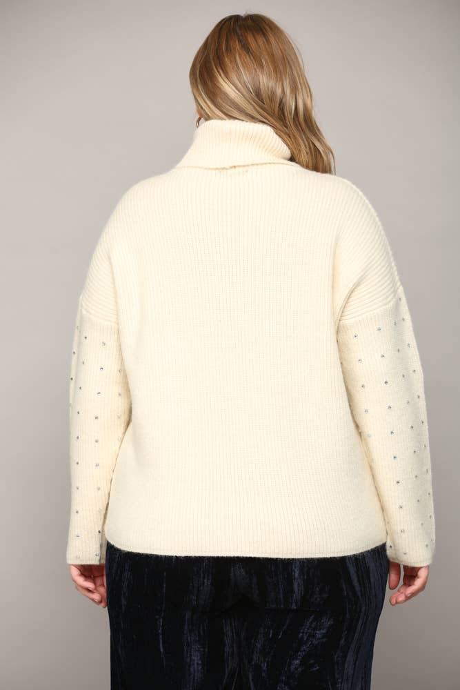 CREMA MAGLIONE A COLLO ALTO IMPREZIOSITO DA STRASS FW9411P in vendita all'ingrosso su Faire4