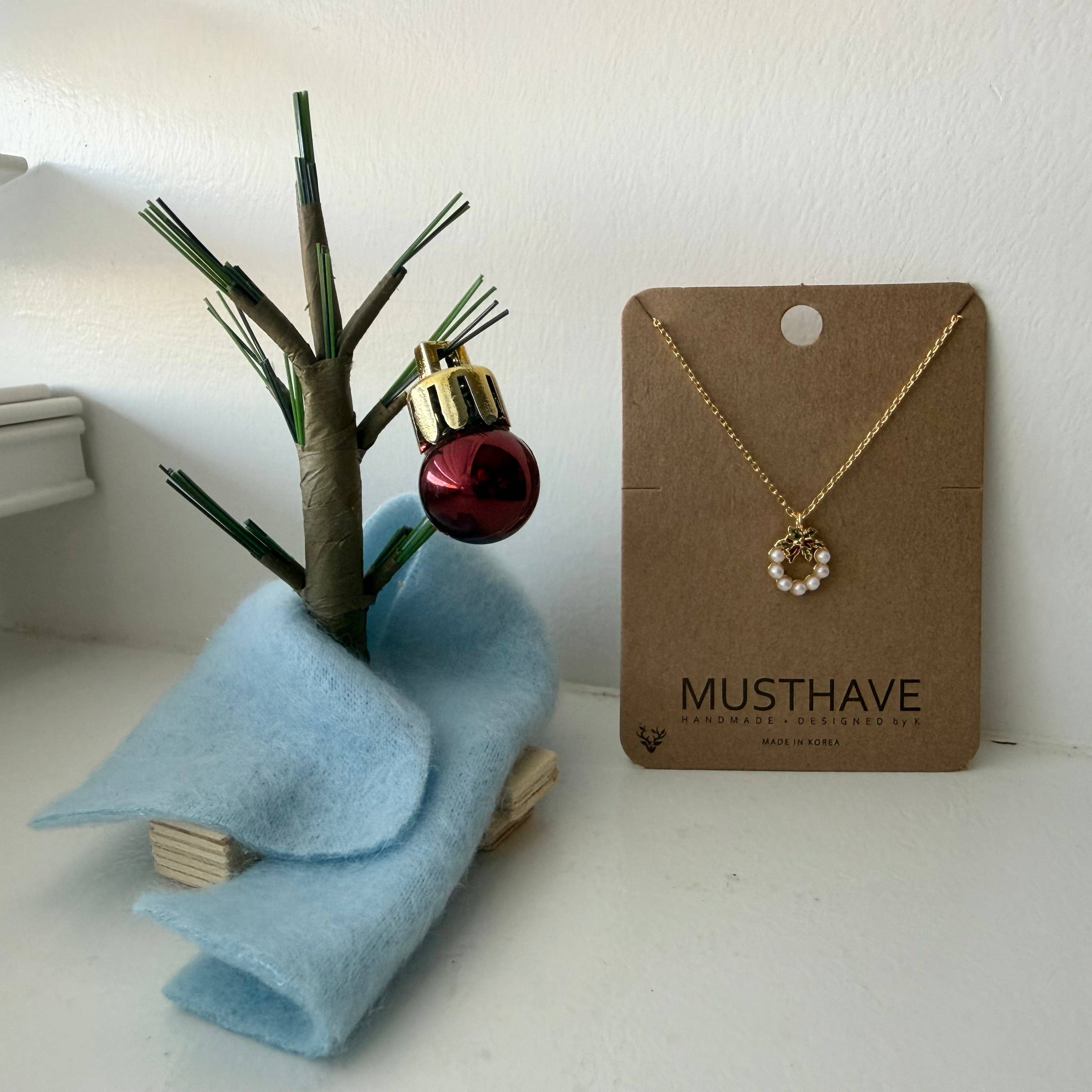 Gold Holiday Wreath Necklace for wholesale on Faire2