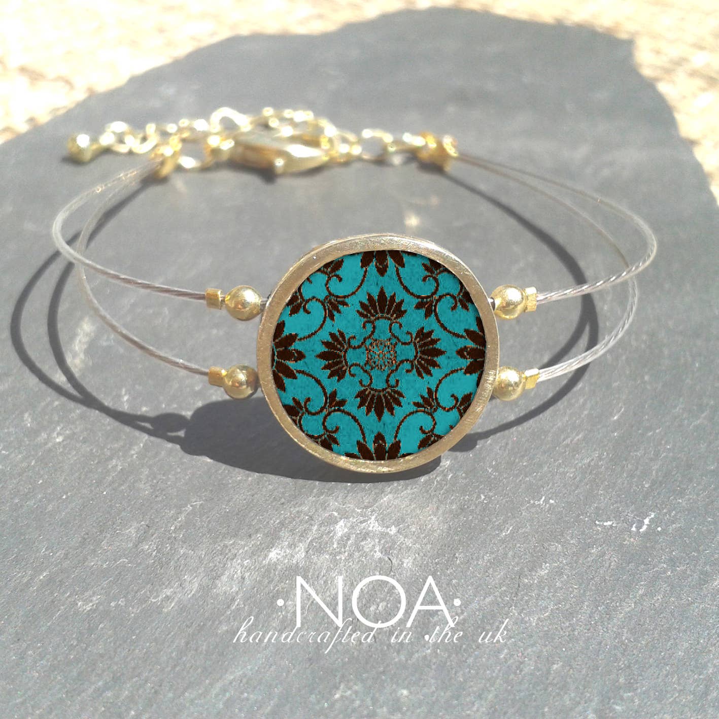 Noa Jewellery – wholesale Charm/dangle bracelet – Round Ceramic Bracelet, Gold Plated Stainless Steel Frame15