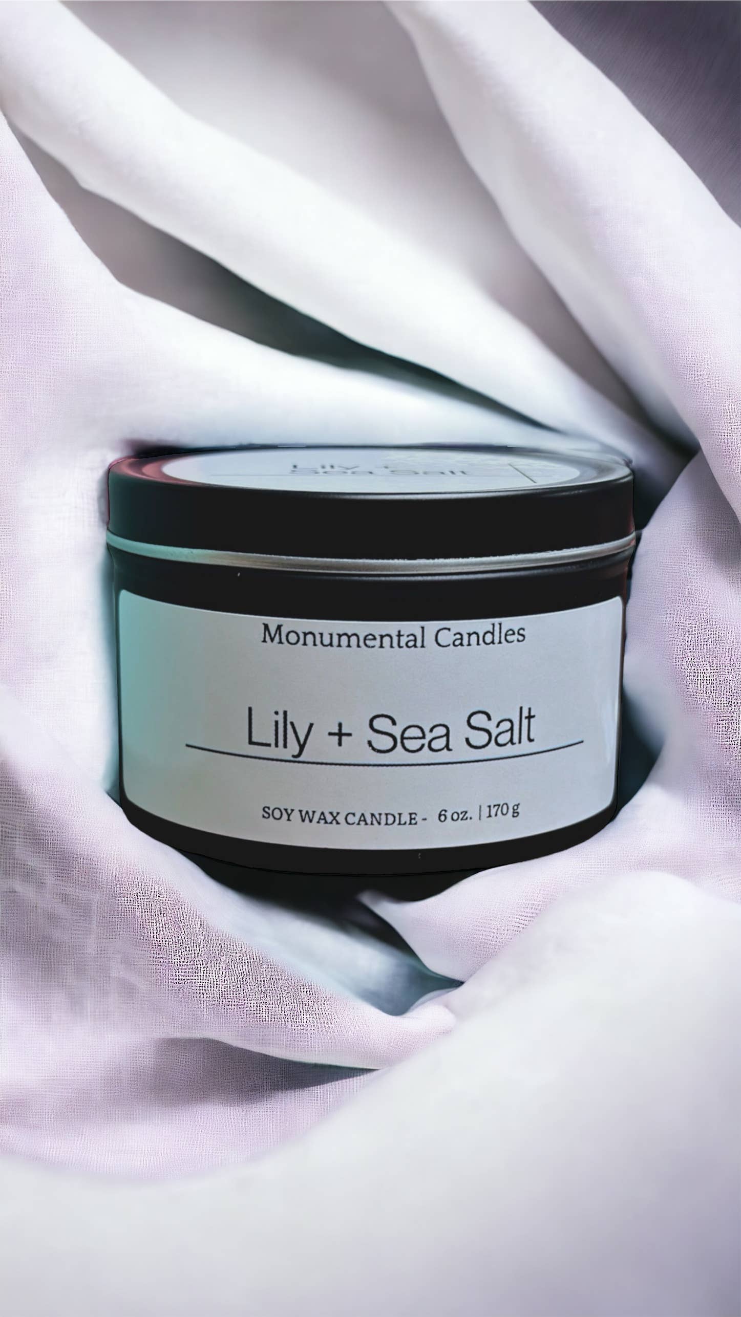 Monumental Candles LLC - Wholesale Travel candles - Lily + Sea Salt - 6 oz Matte Black Tin Candle1