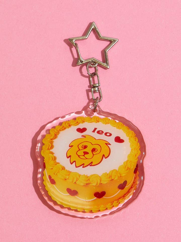 Leo Glitter Horoscope Cake Keychain for wholesale by The Gemini Bake