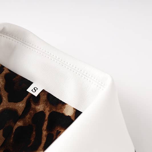 BL035 PU White Blazer: Bold Black Trim & Wild Lining for wholesale on Faire