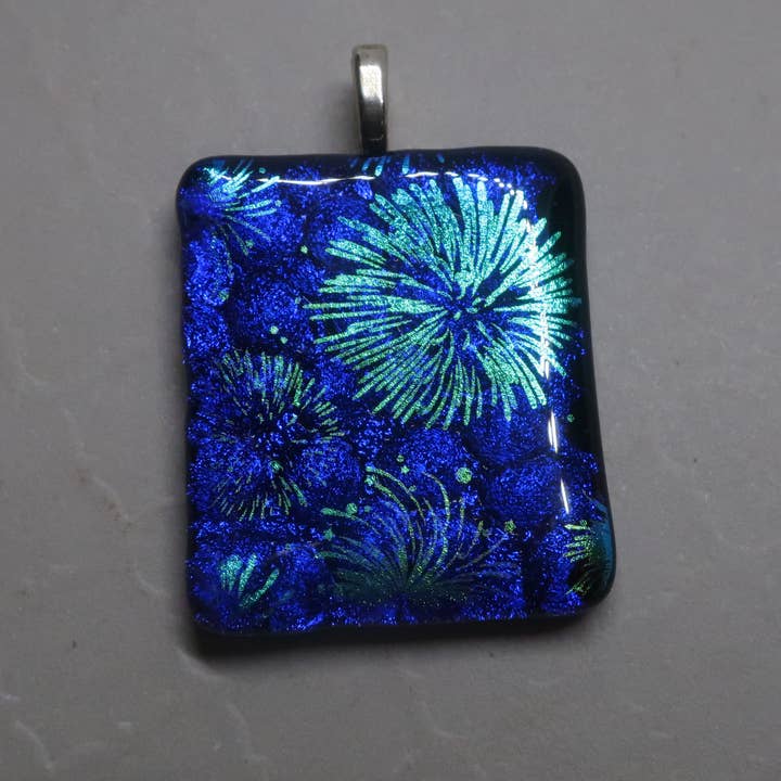 Fused Dichroic Glass Fireworks over Blue Dichroic Pendant for wholesale by McCray Studios
