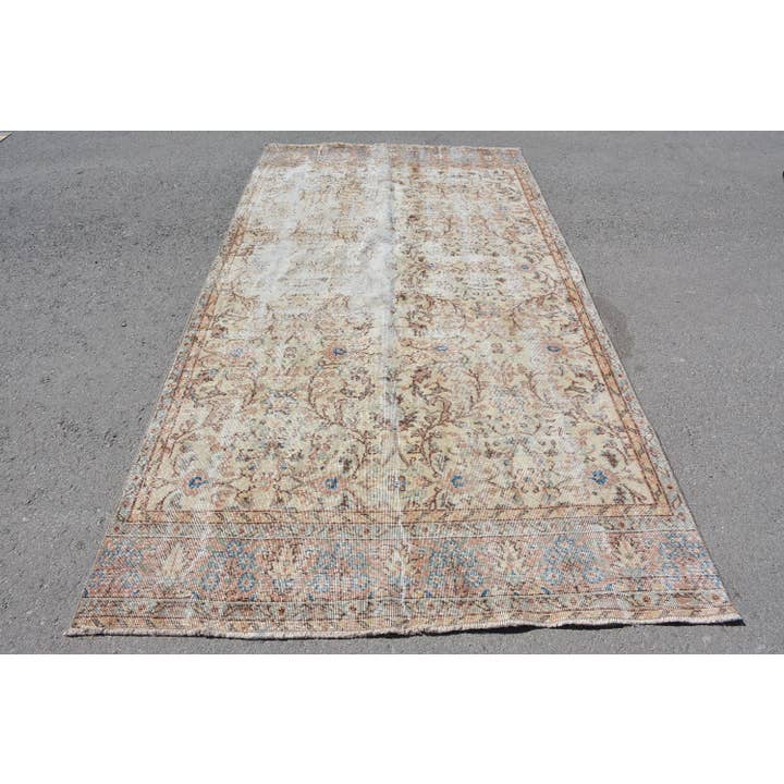 Distressed Wool Rug: Classic Beige & Blue Design for wholesale by The Loom Wholesale