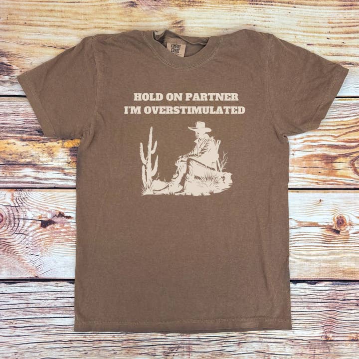 Sage & Soil - Wholesale T-Shirt (Graphic) - Women's - Hold On Partner I'm Overstimulated Western Adult T-shirt