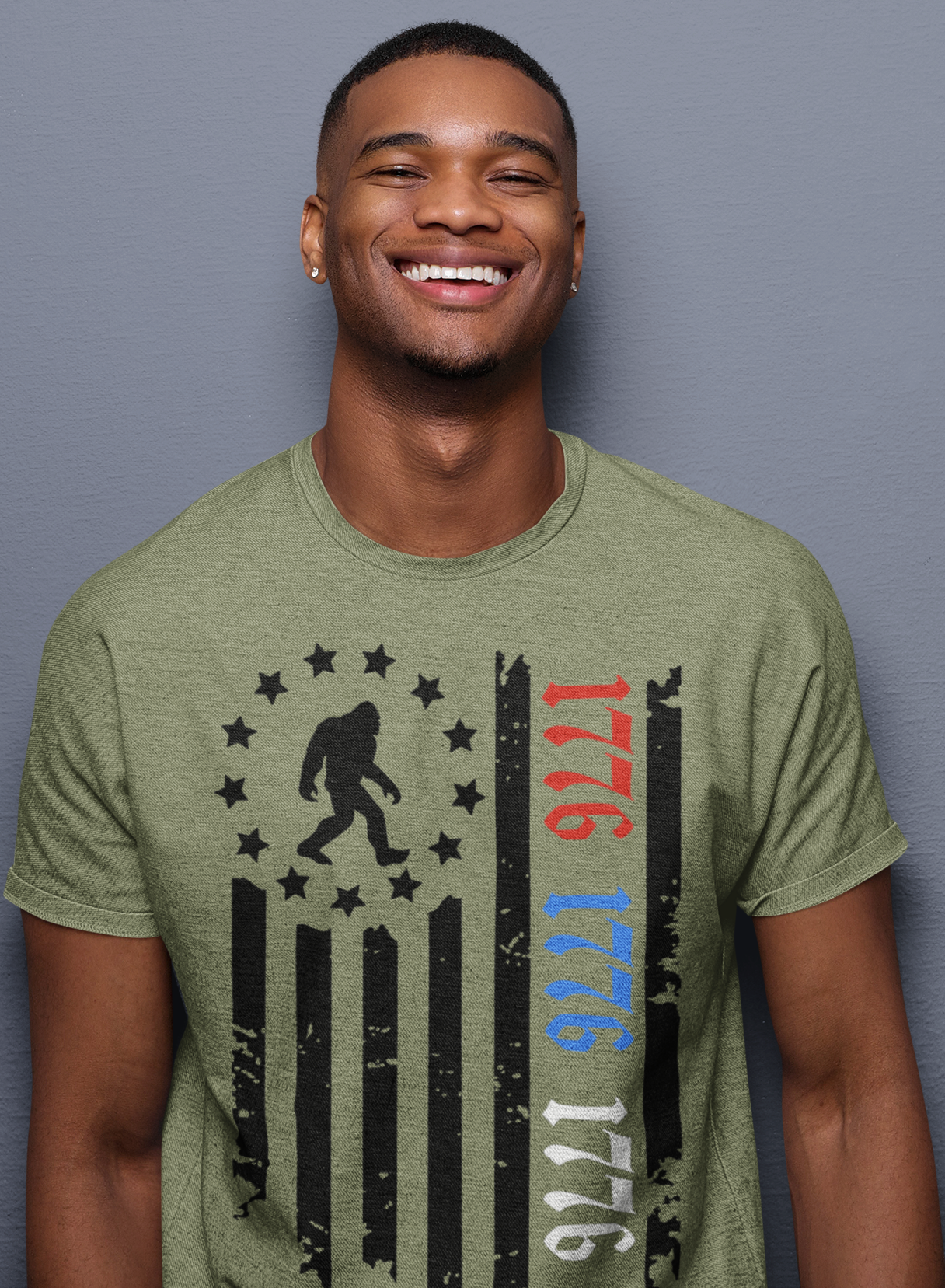 Squatchin’ Country - Wholesale T-Shirt (Graphic) - Unisex - Patriotic 1776 Bigfoot flag shirt - heather military green3