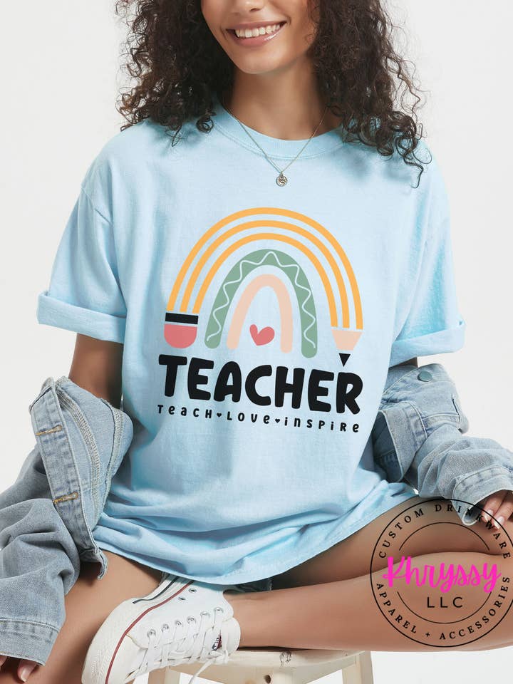 Uplifting Rainbow Teacher Inspiration Comfort Colors T-shirt for wholesale by Khryssy,LLC