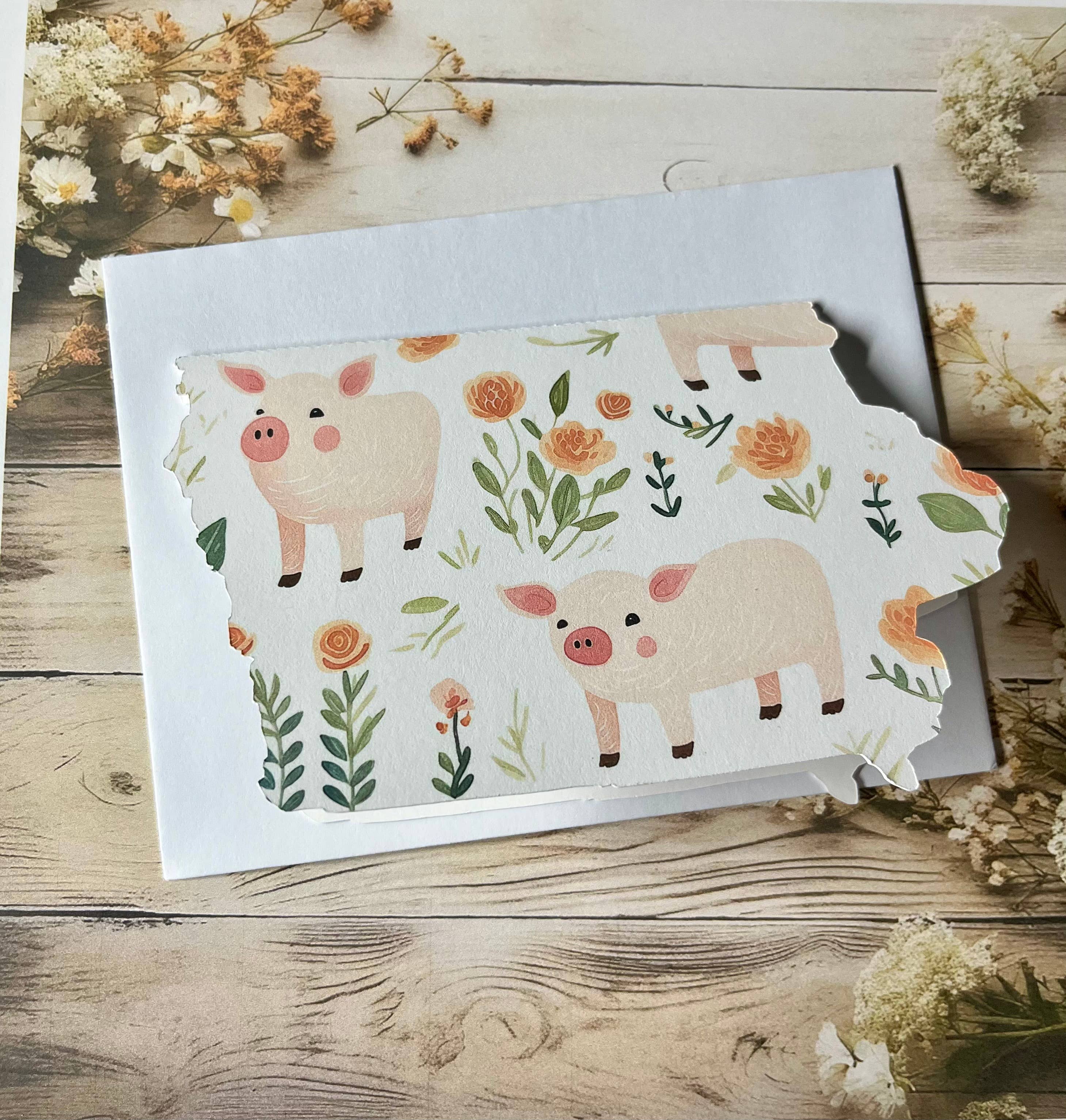 Iowa Paper Farm – wholesale Season’s Greetings card – Iowa with pigs and flowers greeting card - single1