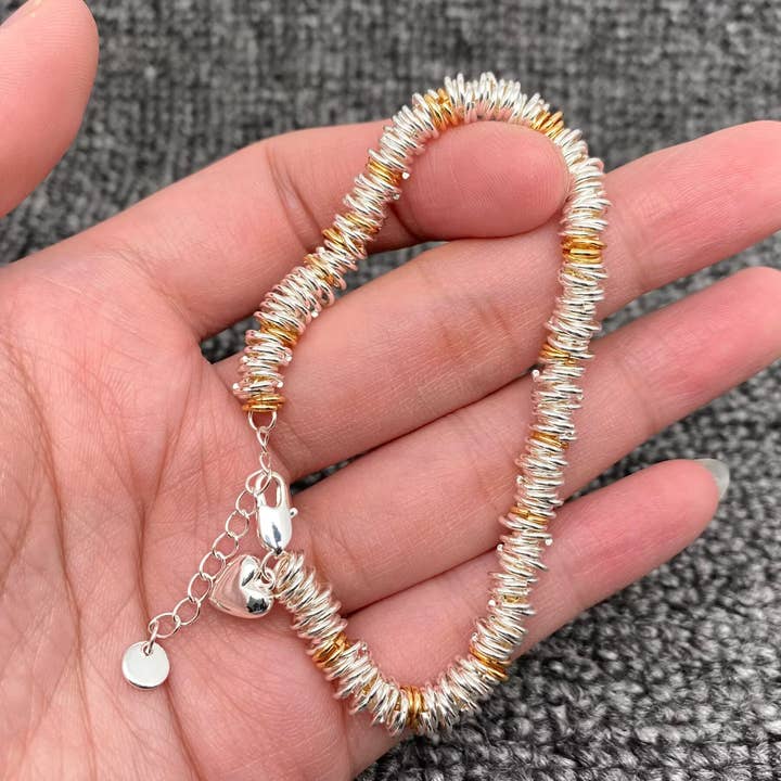 Hjertecharm To-farvet Metalring Snorarmbånd for engroshandel hos Mio Queena