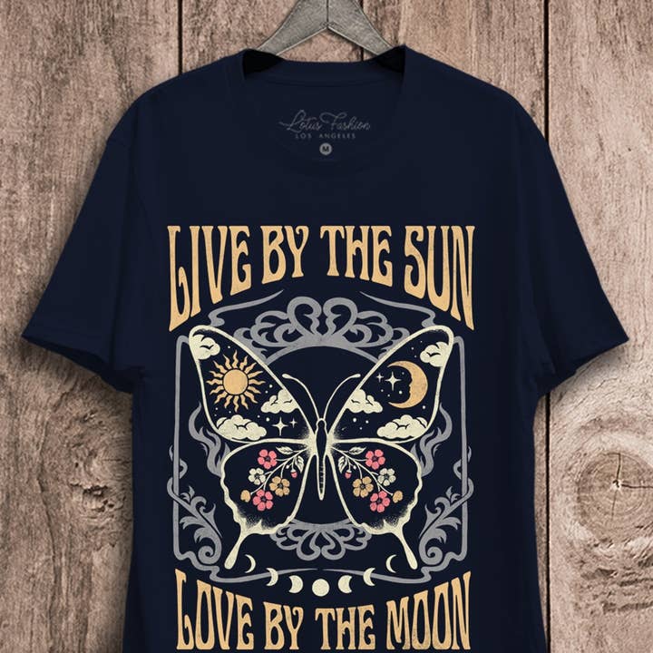 Live By The Sun Love By The Moon Graphic Top and other Purchase Wholesale clothes labels. Free Returns & Net 60 Terms on Faire trending on Faire.