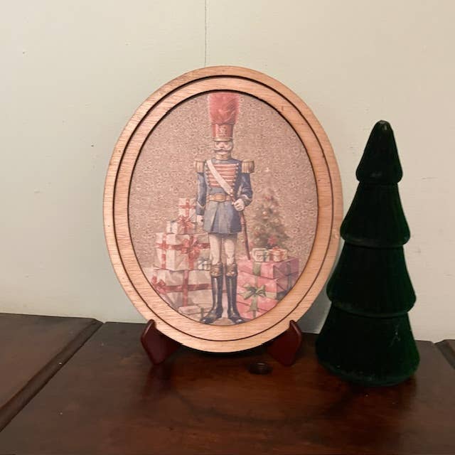 Nutcracker Print Framed in Oval Frame for wholesale by LAND OF COTTON