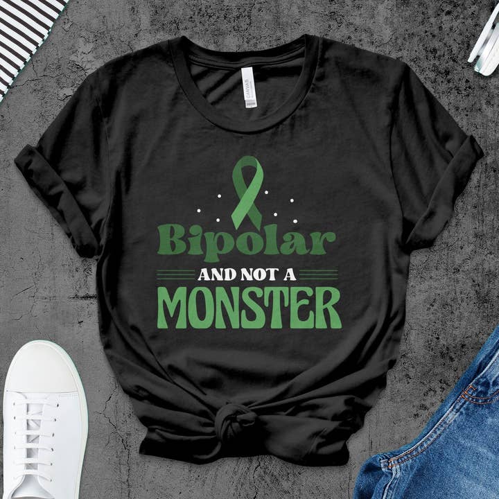Bipolar Awareness T-Shirt, Funny Monster Graphic Tee, Mental Health Support Shirt, Unisex Green Ribbon Tee, Wellness Advocacy Apparel for wholesale by FreakyTeeFactory