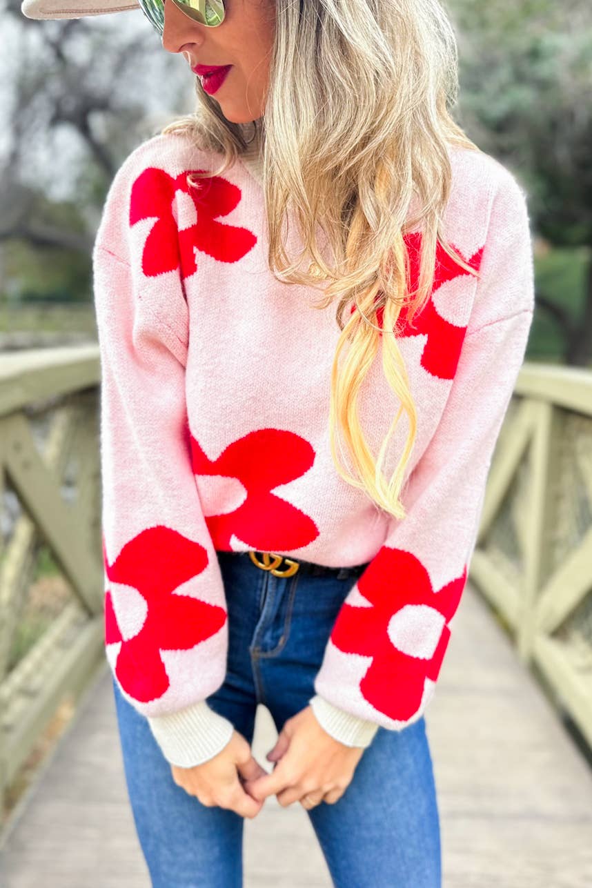 Rouge Pull douillet en tricot imprimé de marguerites rouges en vente sur Faire1