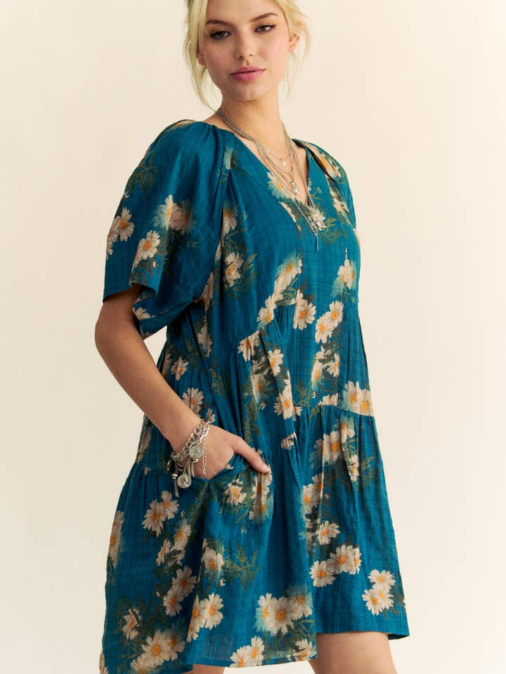 Teal Blue FLORAL PRINT SHORT BELL SLEEVE PLEATED MINI DRESS for wholesale on Faire