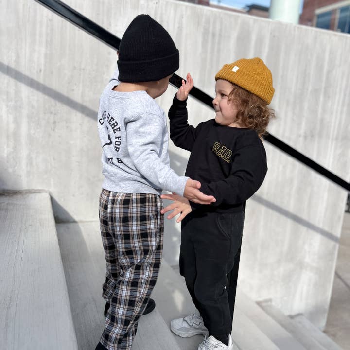 Black Rad Kids Crew Sweatshirt (Black) for wholesale on Faire