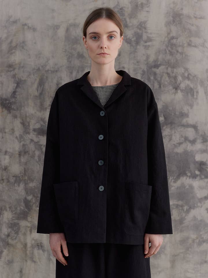 Veste noire avec poches pour la vente par muku