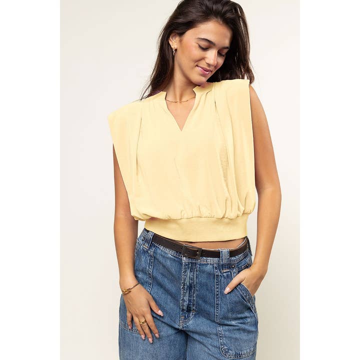 Haut avec épaulettes et détails en bord-côte pour la vente par Naked Zebra Rack