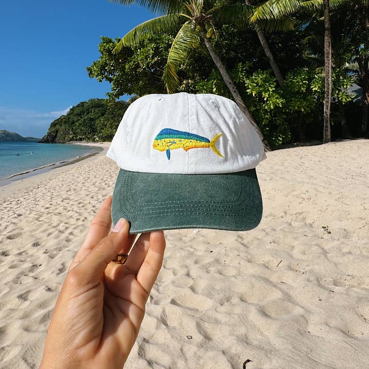 Mahi Mahi Fish Lid | White & Green Cotton Dad Cap and other Purchase Wholesale cycling caps. Free Returns & Net 60 Terms on Faire trending on Faire.