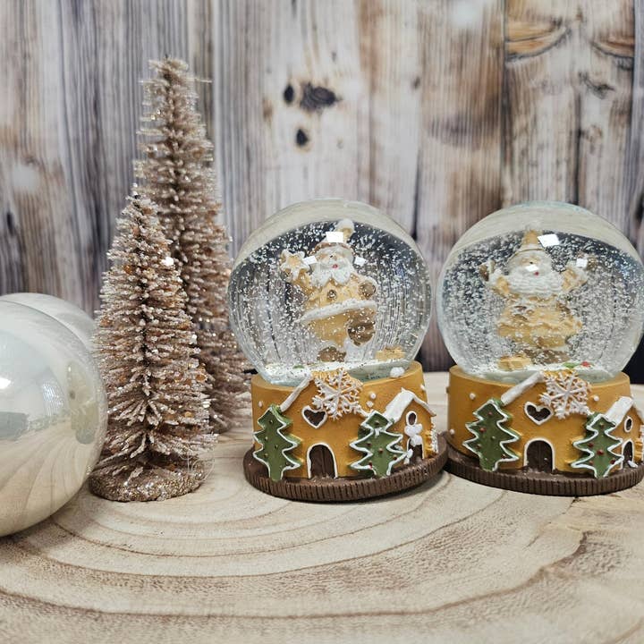 Schneekugelhaus - Venta al por mayor Globos terráqueos - 2 bonitas bolas de nieve de confitería sobre una base navideña de 65 mm de diámetro