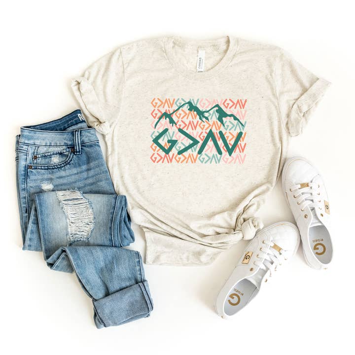 God Is Greater Mountains | Short Sleeve Graphic Tee for wholesale by Uplifting Threads Co Wholesale