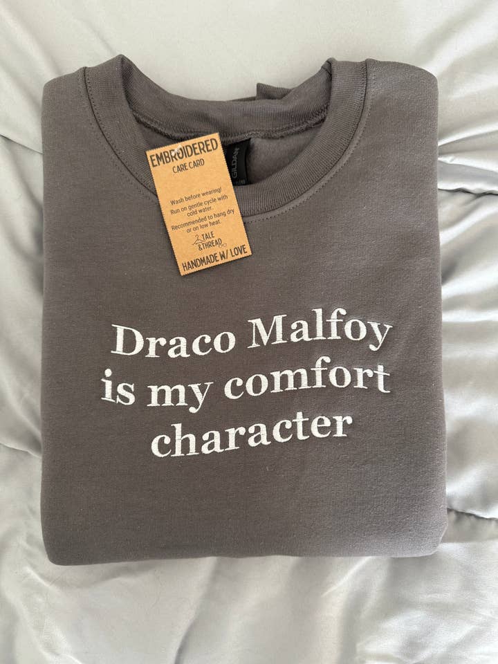 Custom Comfort Book Character Embroidered Crewneck for wholesale by Tale & Thread LLC