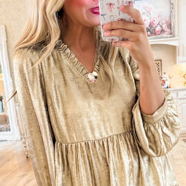 Gold Metallic Frilled V Neck Puff Sleeve Babydoll Blouse and other Purchase Wholesale blouses. Free Returns & Net 60 Terms on Faire trending on Faire.