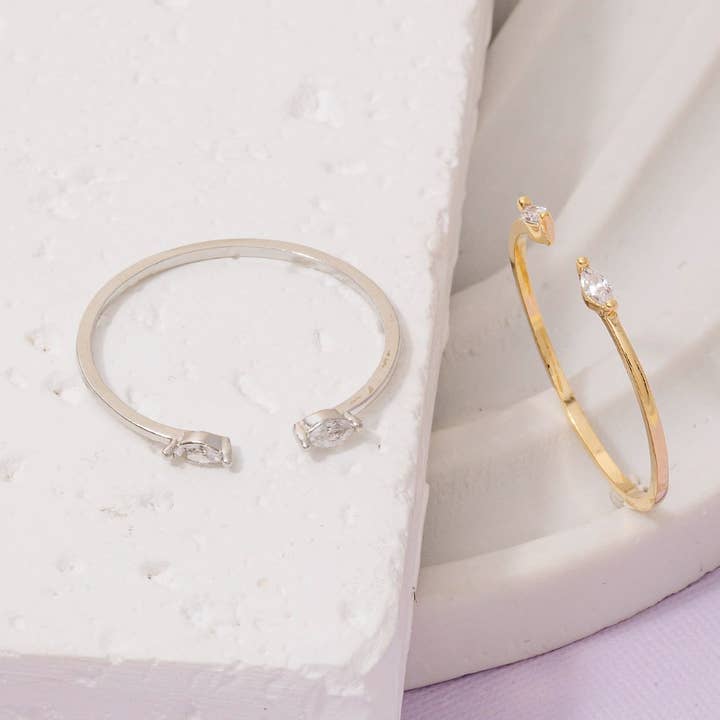 Guldbelagt dobbelt marquise-slebet cz åben båndring for engroshandel hos The Looks by Fame Accessories