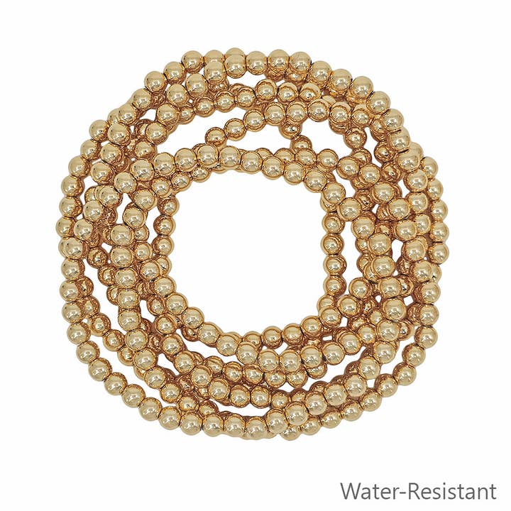Water Resistant Set of 7 Gold Textured 5MM Beaded Stretch Bracelets for wholesale by What's Hot