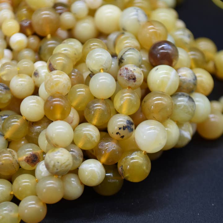 Grade A Natural Yellow Opal Round Beads for wholesale by Oriental Direct Craft Supplies