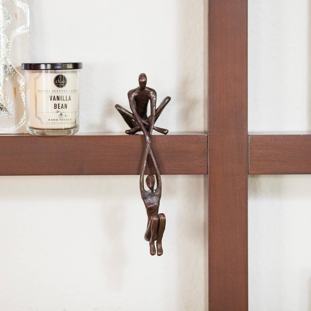 Danya B - Wholesale Sculpture - Man Lifting Woman from Ledge Bronze Sculpture3