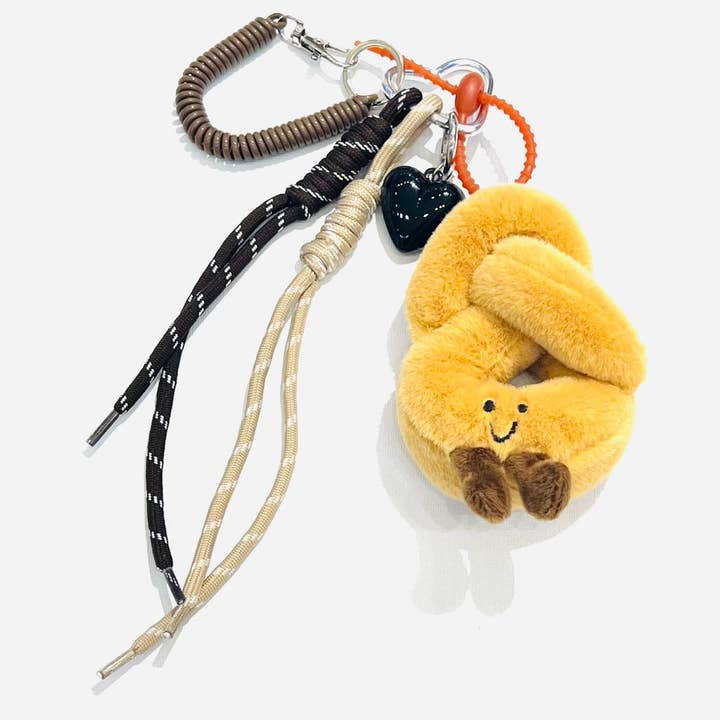 Smiley Pretzel Keychain and other Purchase Wholesale phone charm attachment. Free Returns & Net 60 Terms on Faire trending on Faire.