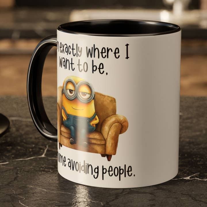 Funny Minion Mug 11oz – “At Home Avoiding People” for wholesale by Wonders Emporium Coffee Co.