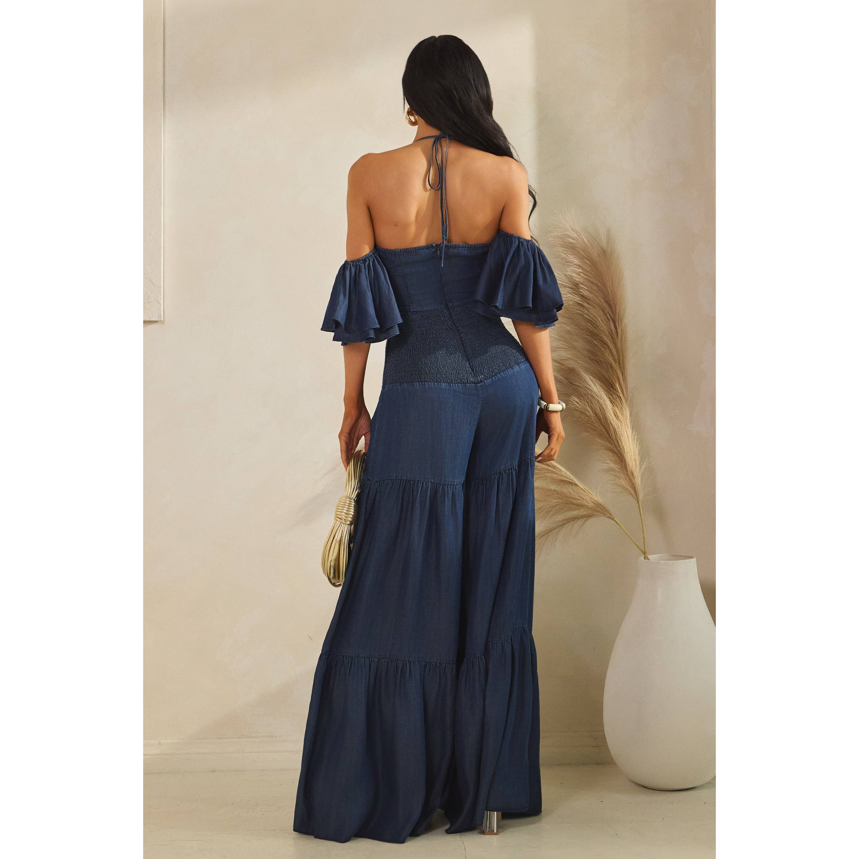 DARK DENIM MINI RUFFLE HALTER NECK TIERED JUMPSUITS for wholesale on Faire6