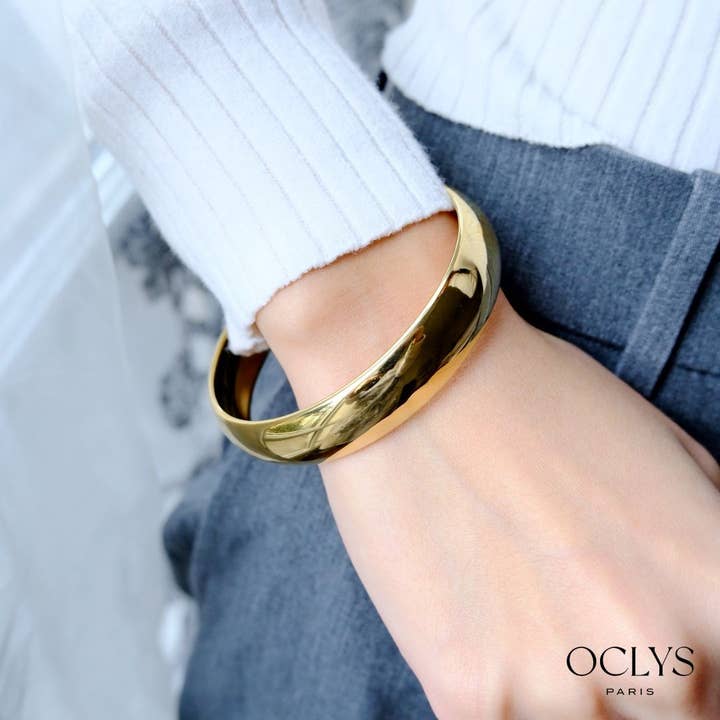 Smooth bangle bracelet in gold stainless steel Dora for wholesale by Oclys