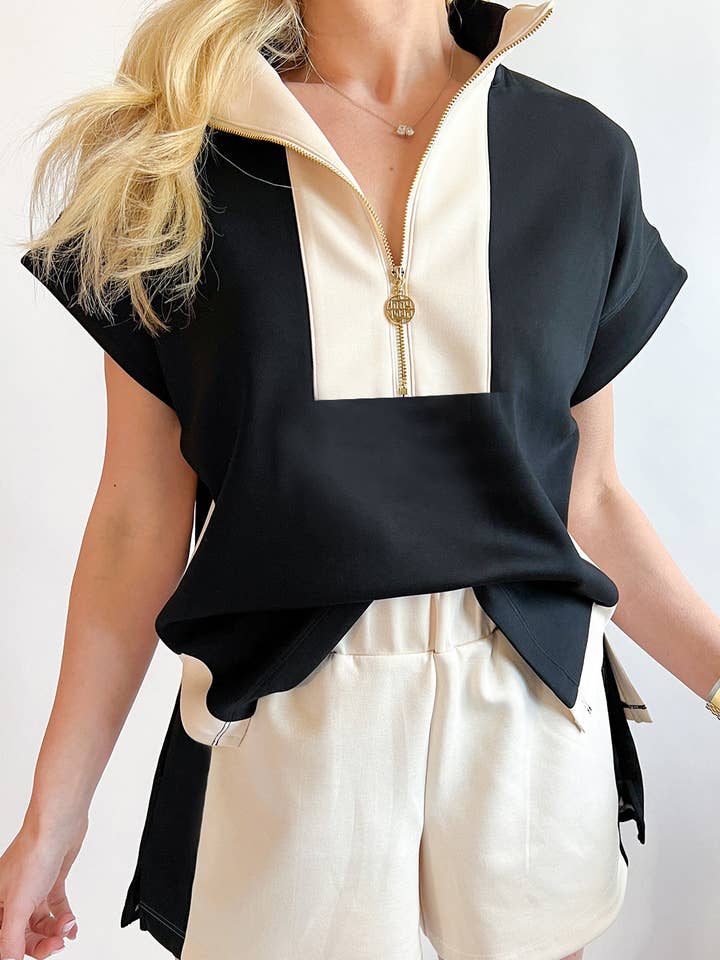 Conjunto de camiseta con cremallera en el cuello y pantalones cortos en color negro a bloques para venta al por mayor de EG fashion