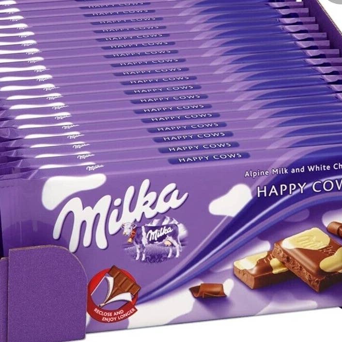 Phoenix Distributions - Venta al por mayor Chocolate - MILKA - Happy Cow, 100 gramos, 23 unidades