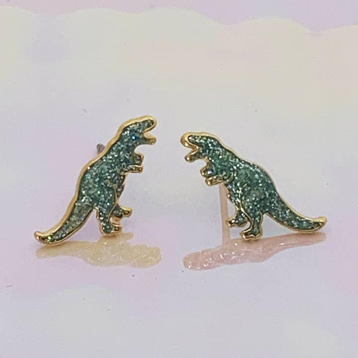 Orecchini a perno con dinosauro T-Rex per la vendita all'ingrosso da parte di Wildflower + Co.