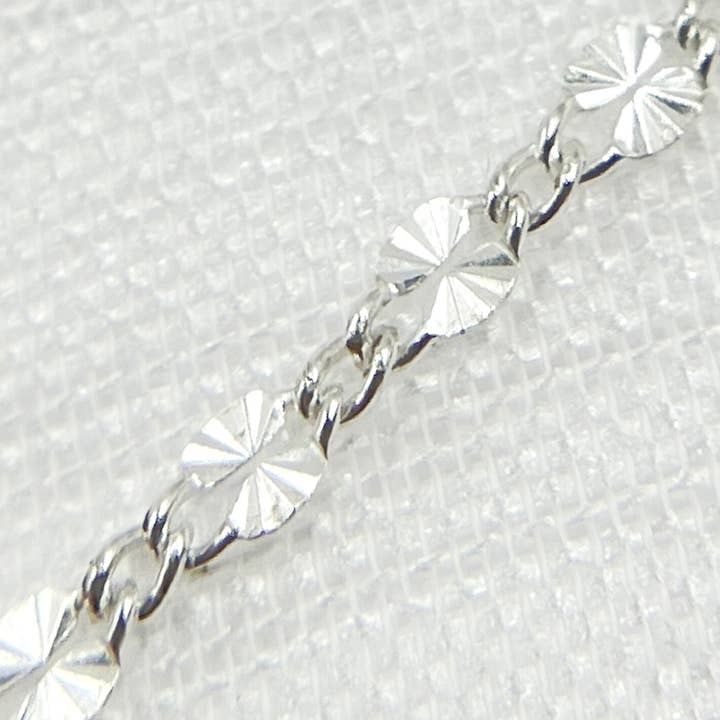 V186SS. Sterling Silver Diamond Cut Flat Marina Link Chain for wholesale by Tresor Jewelry Inc.