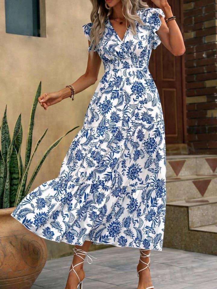 BLUE FLORAL PRINT DRESS WITH BUTTERFLY SLEEVES HEMMED for wholesale on Faire1