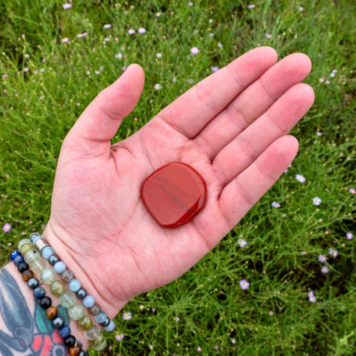 Red Jasper Palm Stone. for wholesale by Down To Earth
