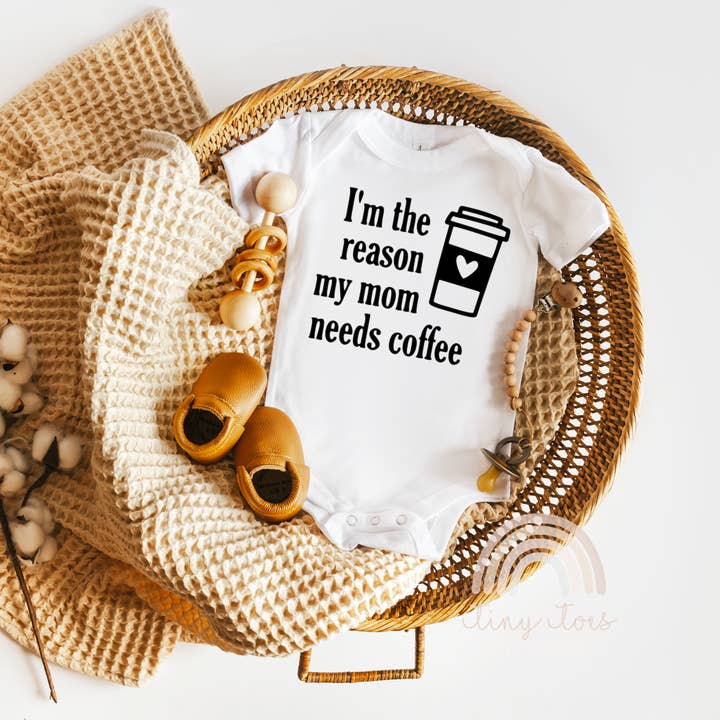 I'm The Reason My Mom Needs Coffee Funny Baby Bodysuit for wholesale by Tiny toes Baby Co