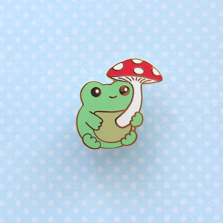 Green Frog with Mushroom Enamel Pin (Gold). Frog Lapel Pin for wholesale by Wild Whimsy Woolies